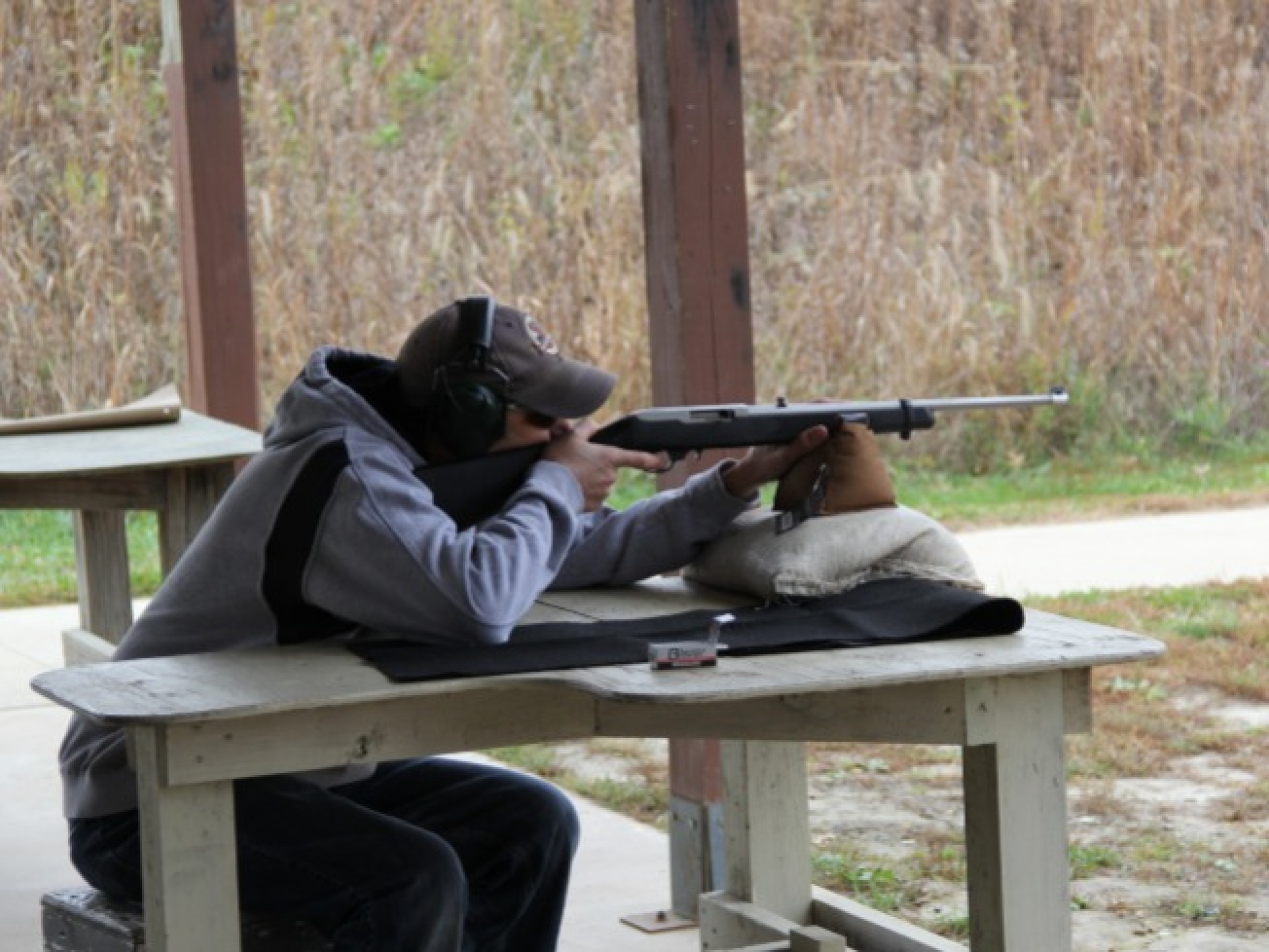 Man at Big Hollow Shooting Range aiming at a target.